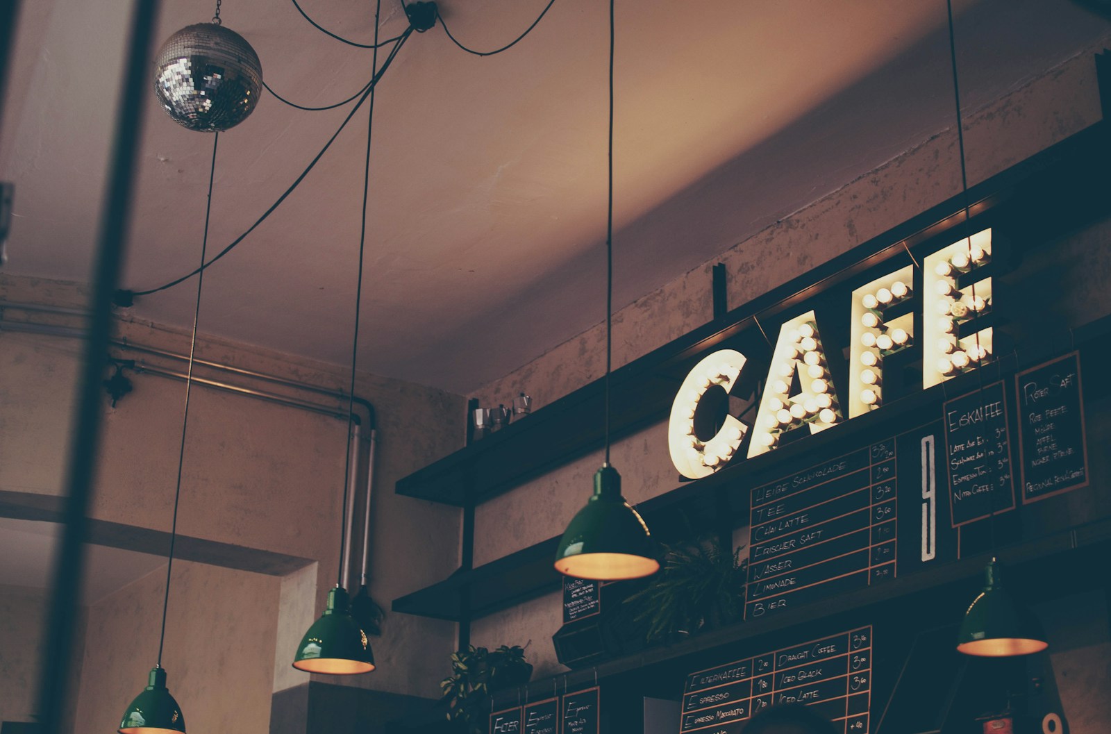 A warm café interior with pendant lighting